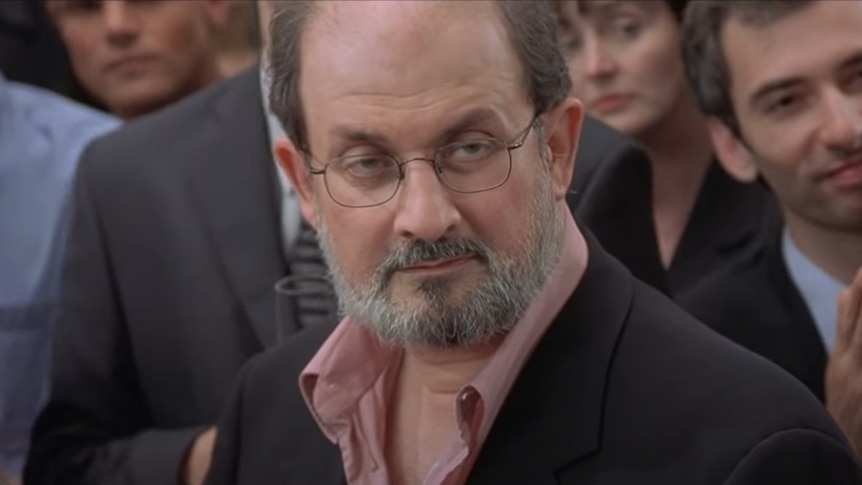 A still of Salman Rushdie's cameo on Bridget Jones' Diary. He looks unimpressed. 