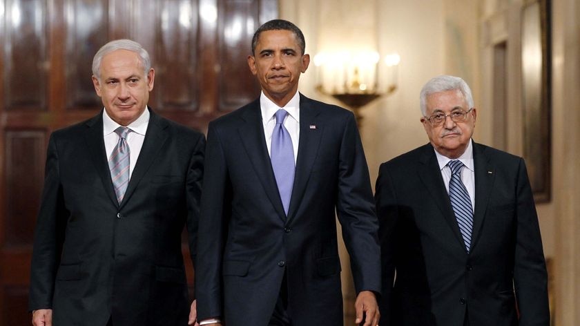 Barack Obama arrives in the East Room with Benjamin Netanyahu and Mahmoud Abbas