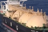 LNG tanker offshore WA, close up with LNG printed on side of ship