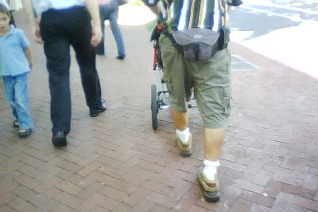 A man wearing cargo pants and a bumbag.
