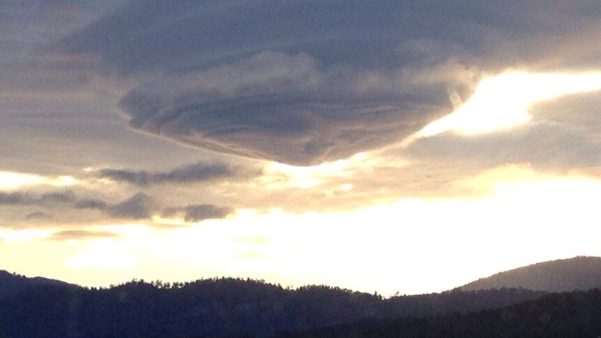 A lenticular cloud forms over the Huon River.