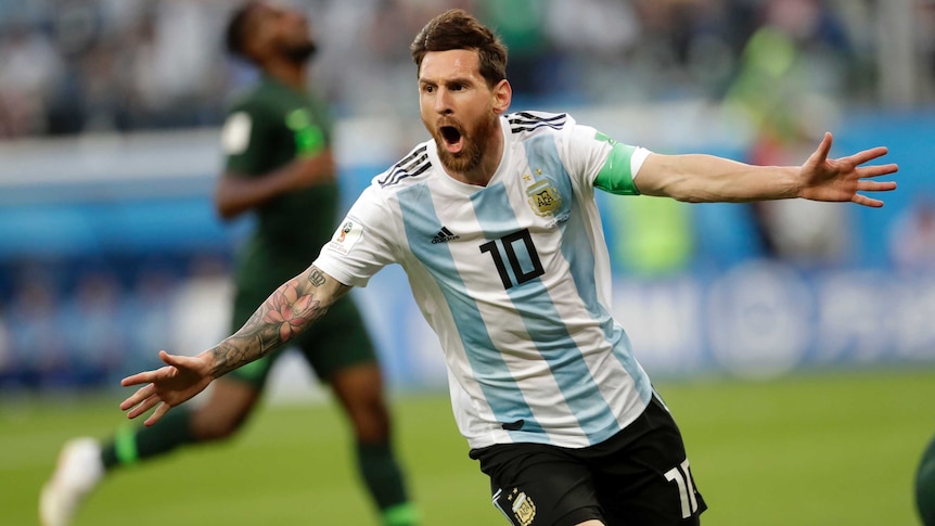 Lionel Messi celebrates scoring against Nigeria
