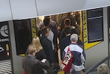People boarding a train