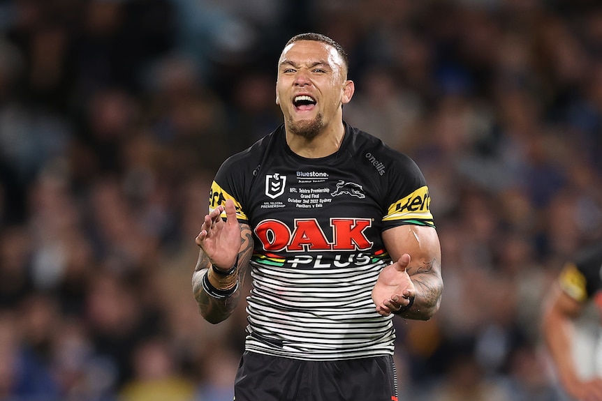 A player celebrates during a rugby league match