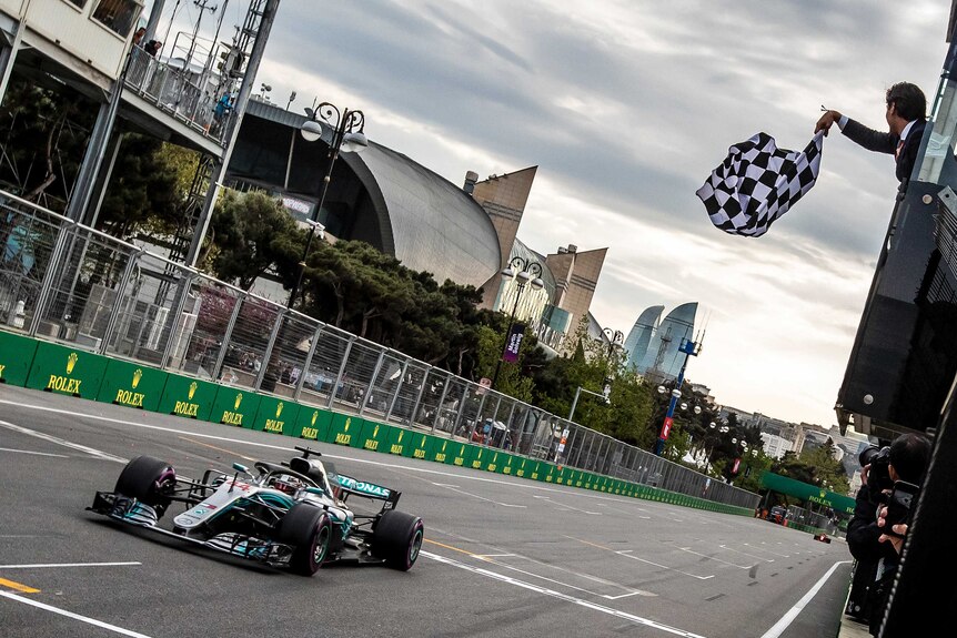 Mercedes driver Lewis Hamilton crosses the finish line to win the 2018 Azerbaijan F1 Grand Prix.