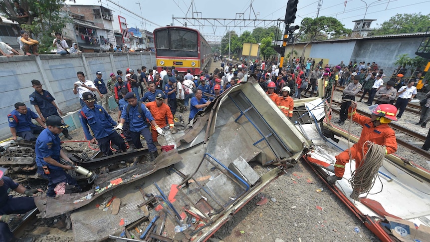 Packed minibus destroyed by oncoming train