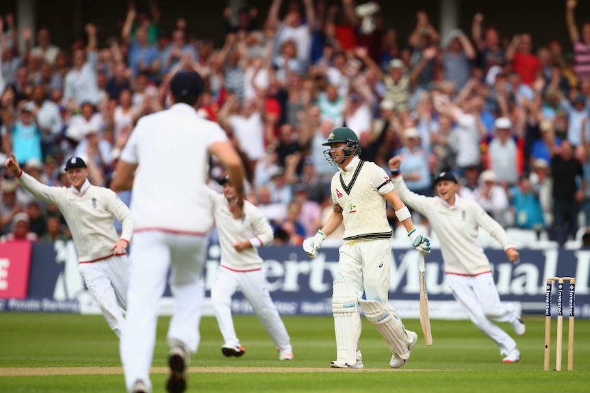 Michael Clarke looks distressed after being dismissed by Broad