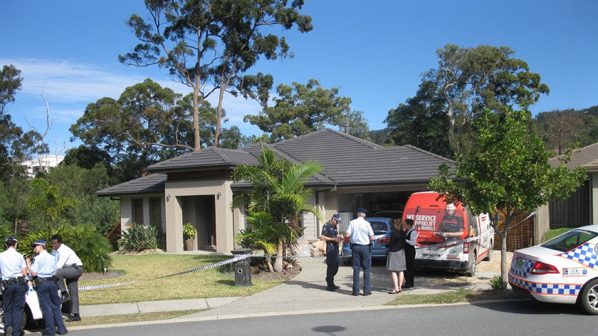 The woman was found dead in her Upper Coomera home shortly before 5am AEST.
