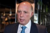 A close photo of Peter Dutton, wearing a suit.