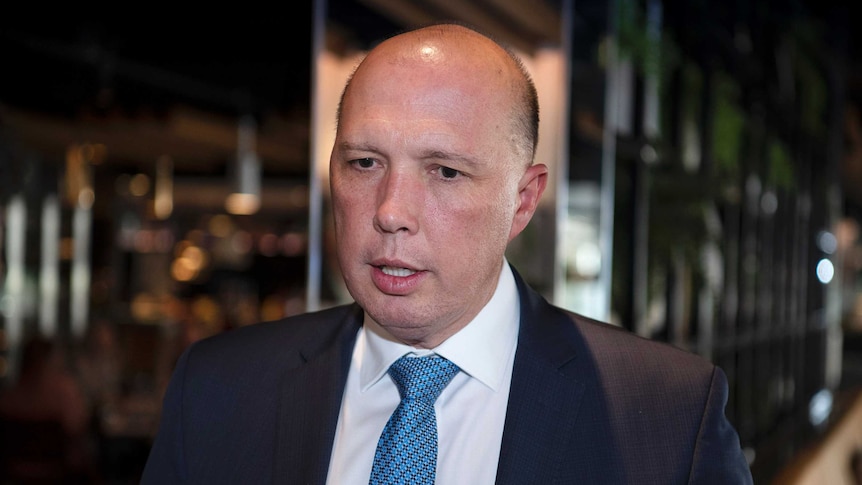 A close photo of Peter Dutton, wearing a suit.