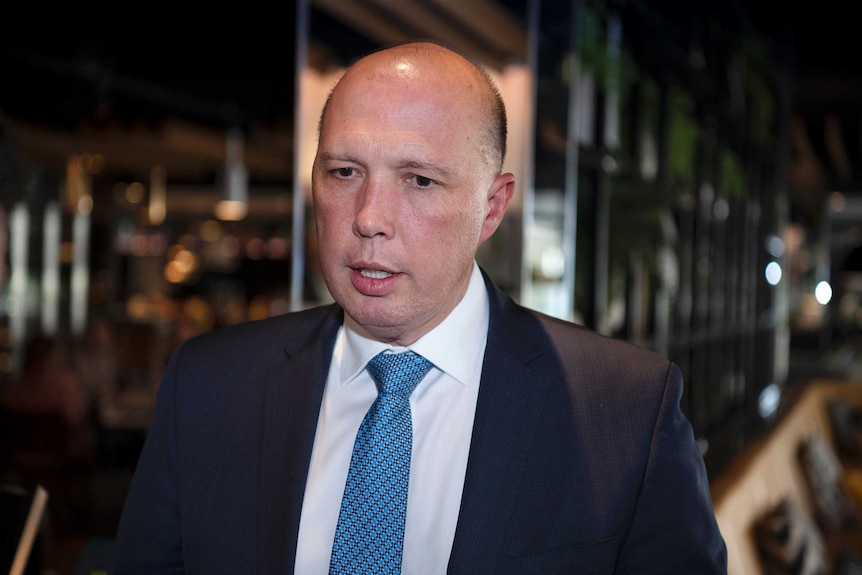 A close photo of Peter Dutton, wearing a suit.