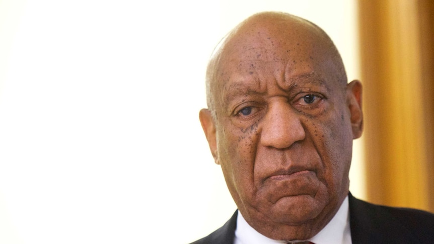 A bald-headed Bill Cosby looks downcast as his verdict is revealed