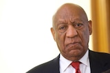 A bald-headed Bill Cosby looks downcast as his verdict is revealed