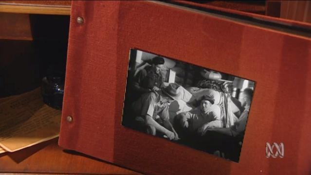 A photo album with an old photo on the front