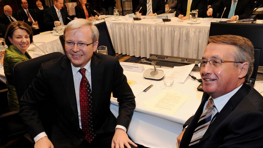 Ms Bligh, Mr Rudd and Treasurer Wayne Swan at the start of the COAG meeting in Sydney on July 3, 2008.