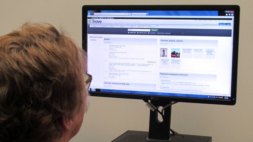 A woman looks up the Trove website developed by the National Library of Australia.