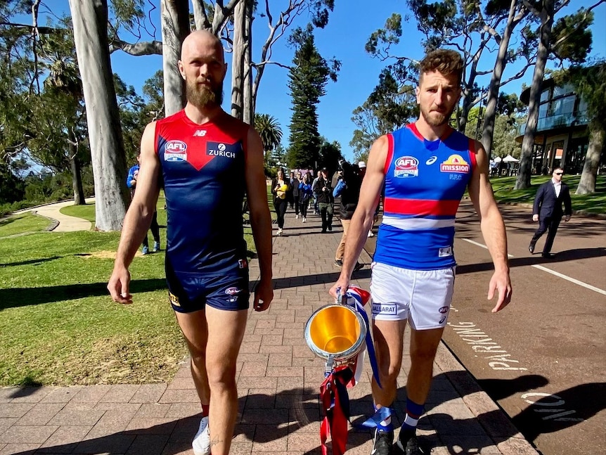 Melbourne Demons captain Max Gawn and Western Bulldogs captain Marcus Bontempelli in Kings Park with the AFL premiership cup.