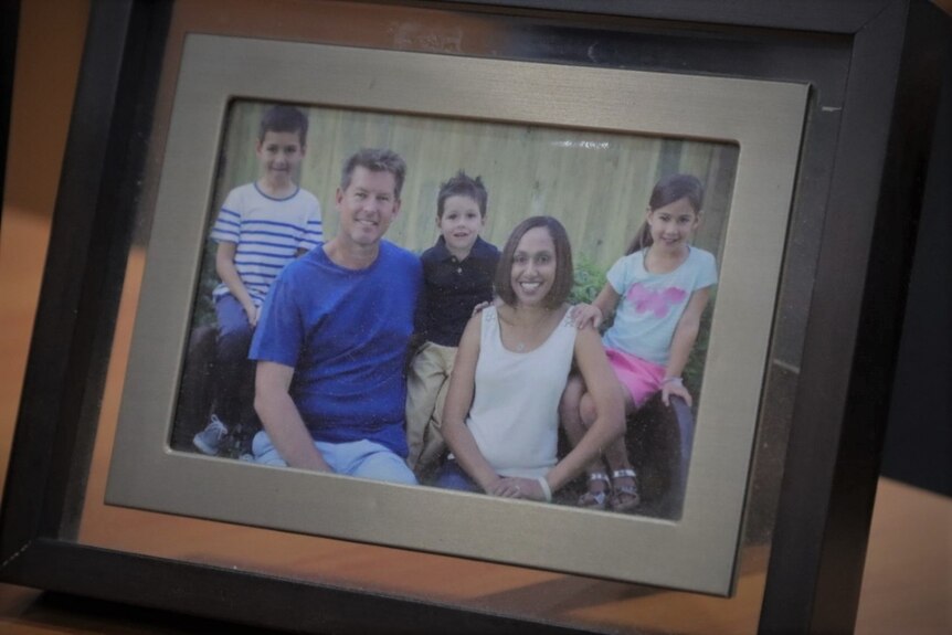 A framed photo of the hodson family.
