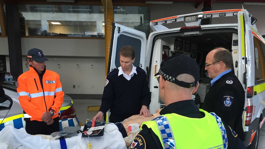 Ambulance officers in Tasmania with a defibrillator.