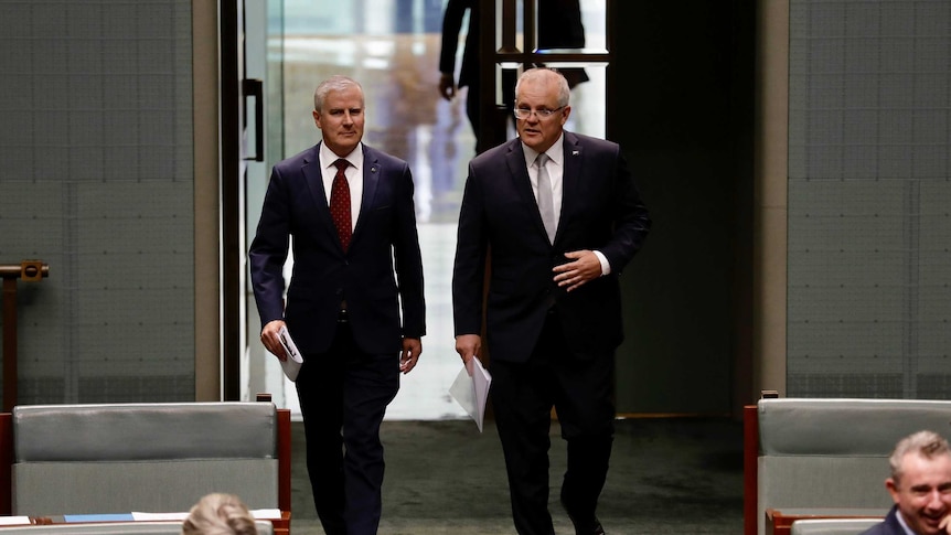 Two men walking into Parliament