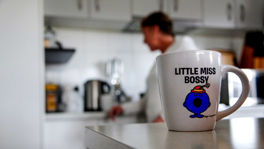 A Little Miss Bossy cup sits on a benchtop at Marree's house.