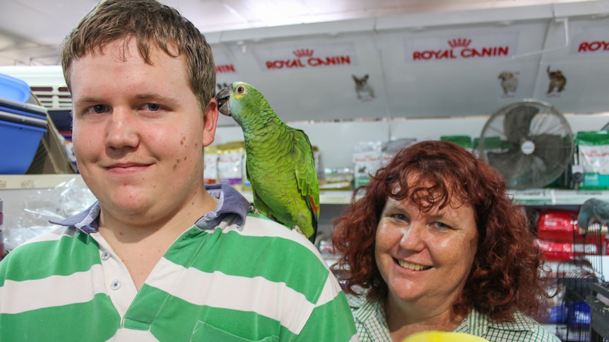 Carter and his mother Rochelle at work with the birds at Sunnybank Hills in Brisbane.