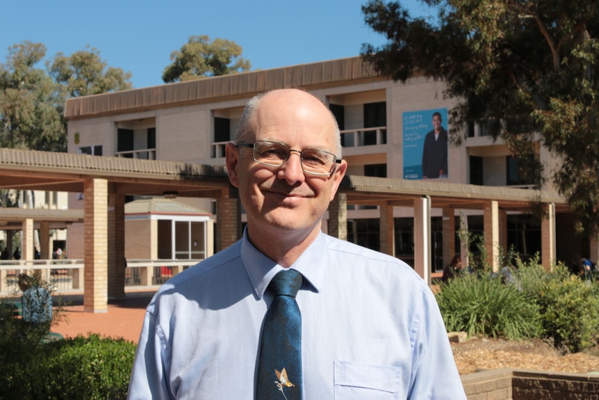 Headshot of Crisp on campus.