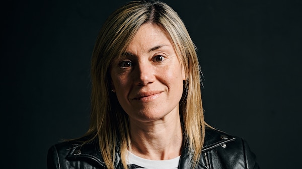 A portrait of a woman in her 40s with blonde hair