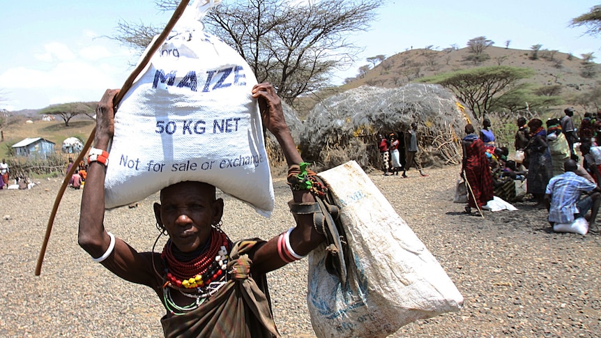 Woman receives food aid in Kenya