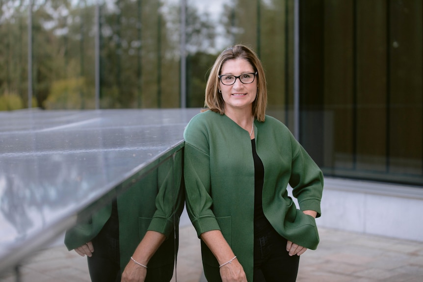 Criminology professor Lorraine-Mazerolle wears a green jacket