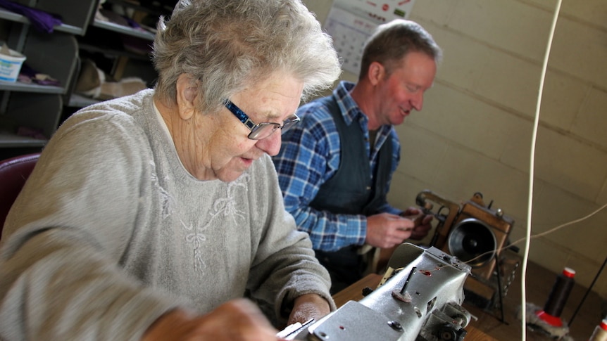 Maria and Hans Dimpel work together making slippers.