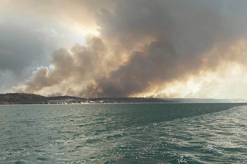 Bushland on fire on Fraser Island, as seen from the ocean