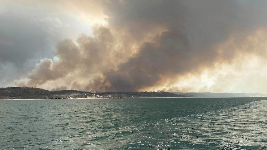 Bushland on fire on Fraser Island, as seen from the ocean