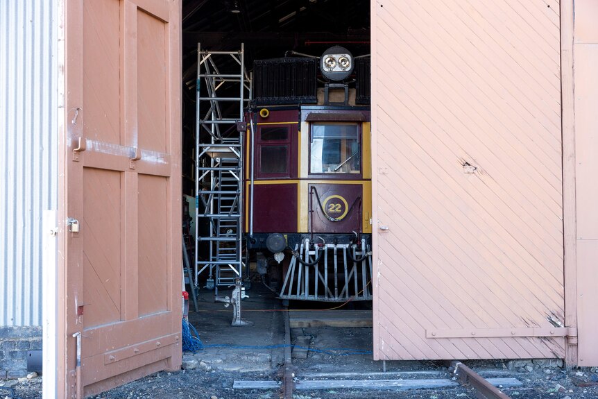An old train tucked away in a shed
