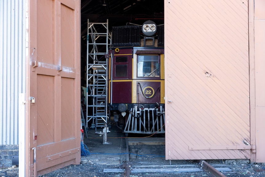 An old train tucked away in a shed