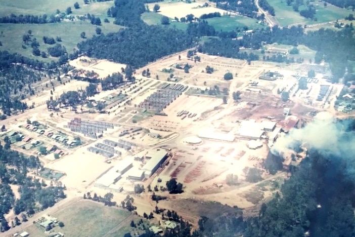 A historic aerial shot of a timber mill.