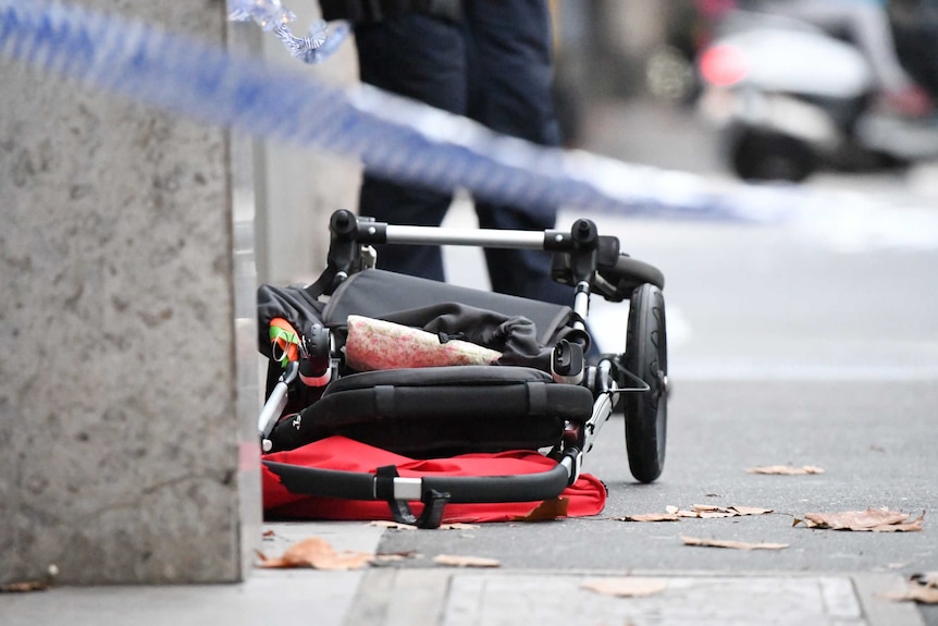 A child's stroller is seen at the scene of a car crash in Melbourne.
