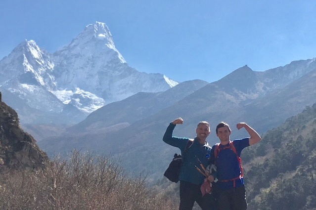 Guy and Zack Stayner flex their biceps in front of Ama Dablam.