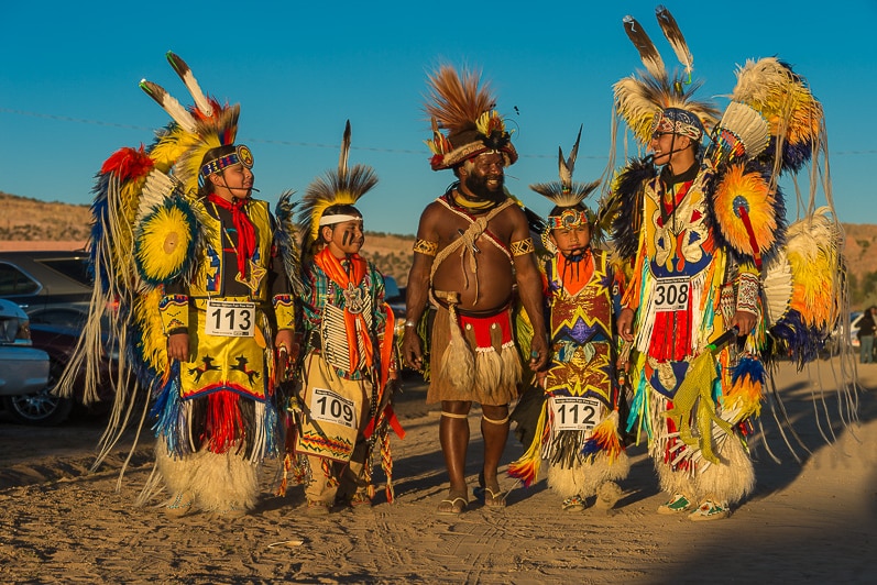 Huli chief Mundiya Kepanga with young navajos wearing ceremonial clothes during a Pow Wow, or traditional dance.