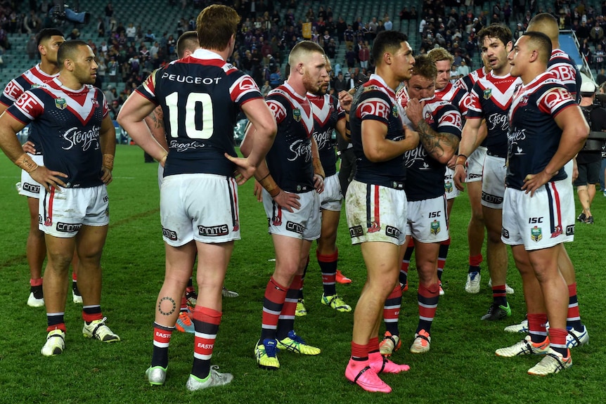 Sydney Roosters mill around after losing to Melbourne Storm in NRL qualifying final