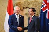 Prime Minister Malcolm Turnbull shakes hands with Indonesian President Joko Widodo.