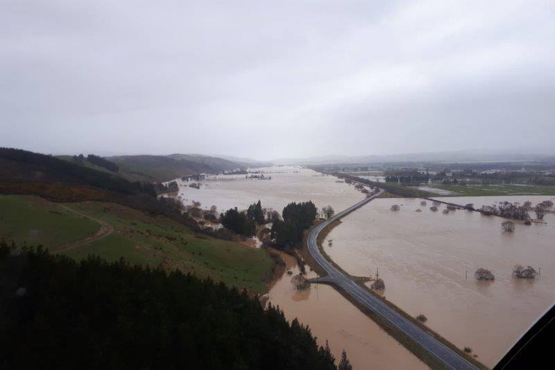 The road is still visible but is surrounded by flooding in otokia