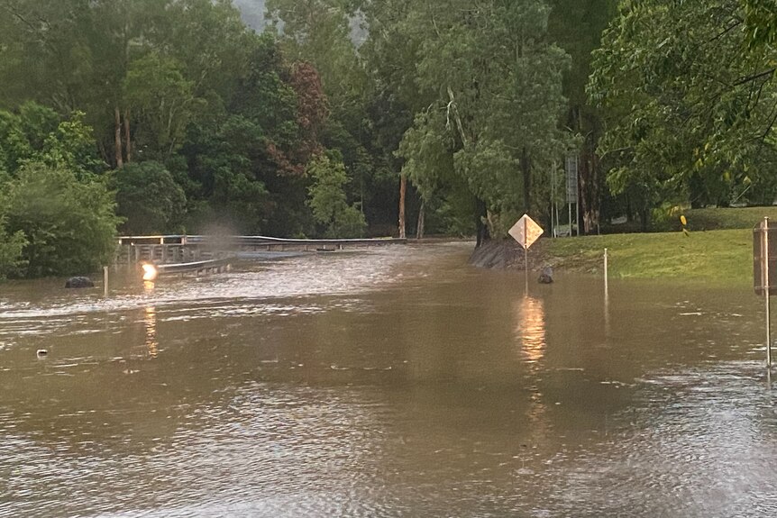 floodwaters over a road way