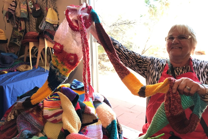 A volunteer working on the worlds longest beanie.