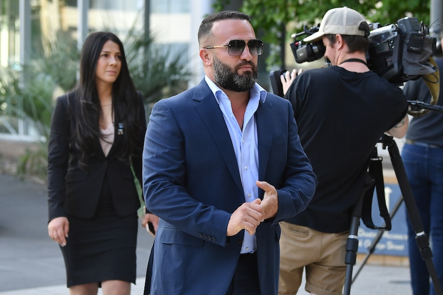 A man and woman arrive at court