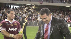 Queensland coach Mal Meninga is sprayed by second rower Carl Webb as they celebrate victory.
