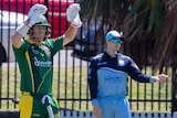 Steve Smith directs fieldsman, as David Warner gestures to the pavilion at Coogee Oval.