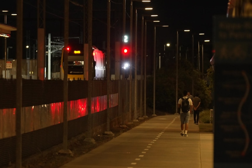 A train departs Redcliffe train station.