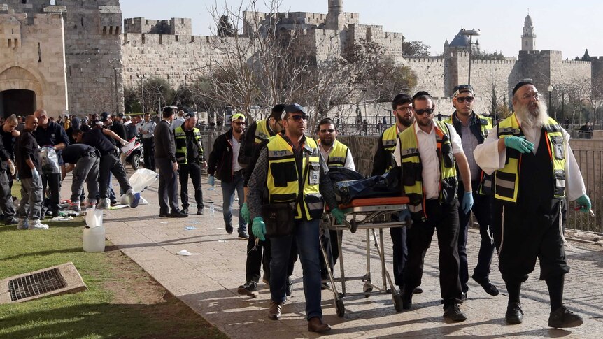 Volunteers take away body of a Palestinian assailant.