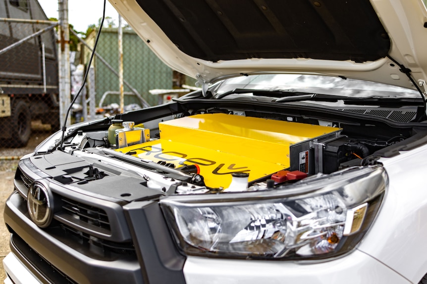 Looking under the bonnet with a big Roev branded yellow battery where the engine was.